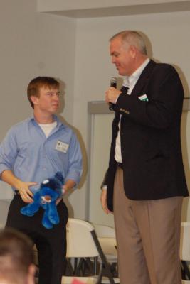 Ryan Allred and Coach Dave Rose at Children's Cancer Christmas Event Coach Dave Rose, Ryan Allred giving away Ryan's Lions